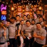 Bachelor party group enjoying indoor axe throwing in Hollywood Florida