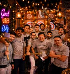 Bachelor party group enjoying indoor axe throwing in Hollywood Florida