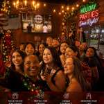Holiday party group enjoying indoor axe throwing at Extreme Axe Throwing Hollywood