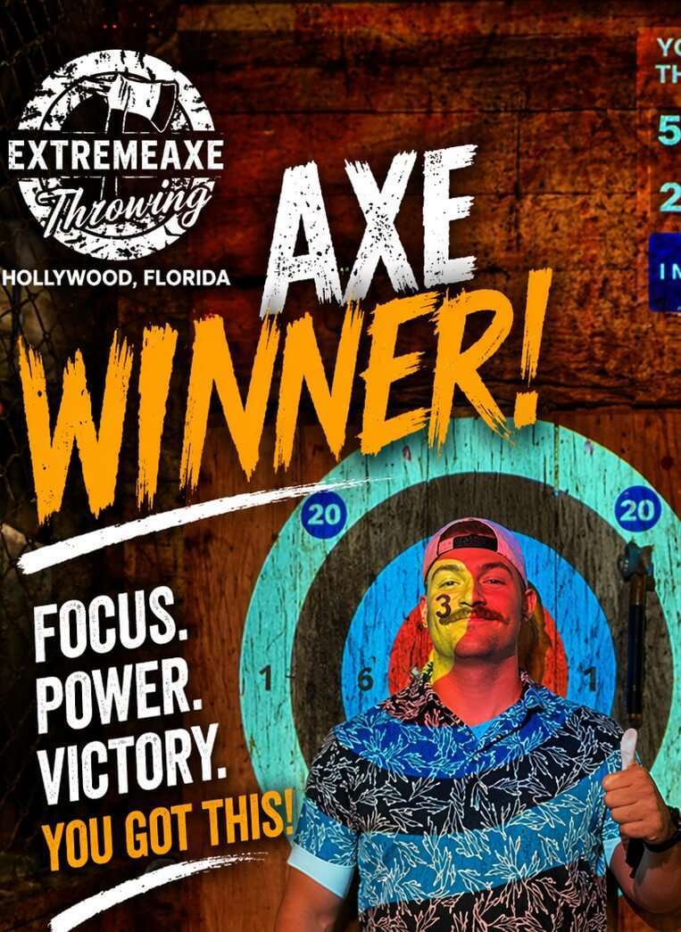 Man holding an axe and celebrating a win in front of a target at Extreme Axe Throwing Hollywood Florida