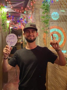 Man holding a sign that says 