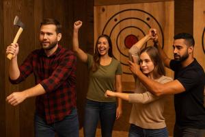 Group of adults participating in axe throwing with instructor guidance at an indoor range in Hollywood, FL.