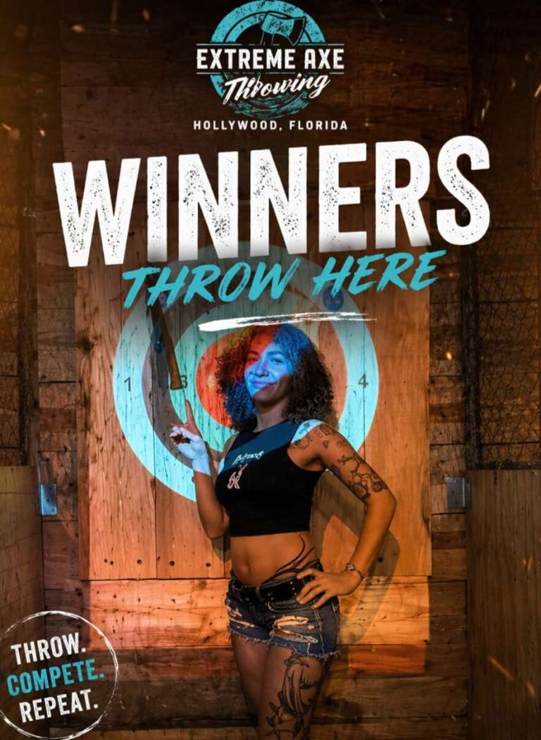 Woman posing with axe in front of target at Extreme Axe Throwing Hollywood Florida winners board