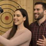 Couple axe throwing together at Extreme Axe Throwing Hollywood Florida