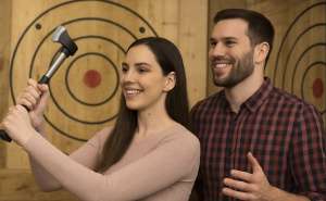 Couple axe throwing together at Extreme Axe Throwing Hollywood Florida