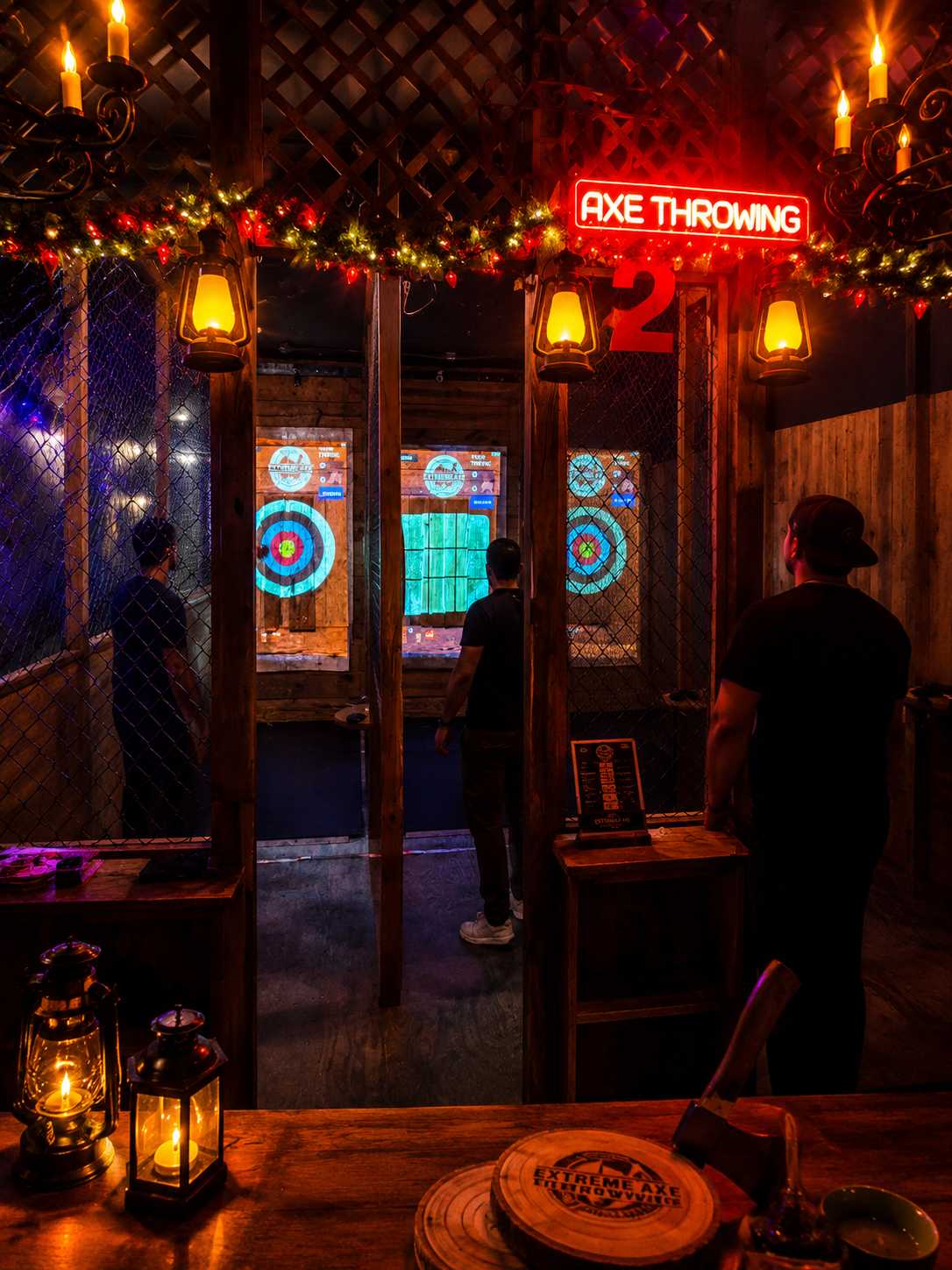 Bachelor party group enjoying indoor axe throwing near Fort Lauderdale in a cozy nightlife atmosphere