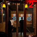 Small group enjoying indoor axe throwing at Extreme Axe Throwing Hollywood in Florida