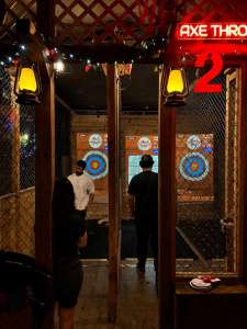 Small group enjoying indoor axe throwing at Extreme Axe Throwing Hollywood in Florida