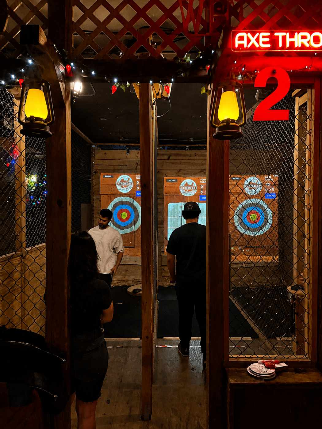 Small group enjoying indoor axe throwing at Extreme Axe Throwing Hollywood in Florida
