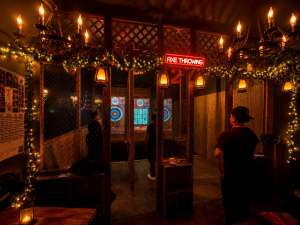Cozy indoor axe throwing venue in Hollywood Florida with warm lighting and social atmosphere